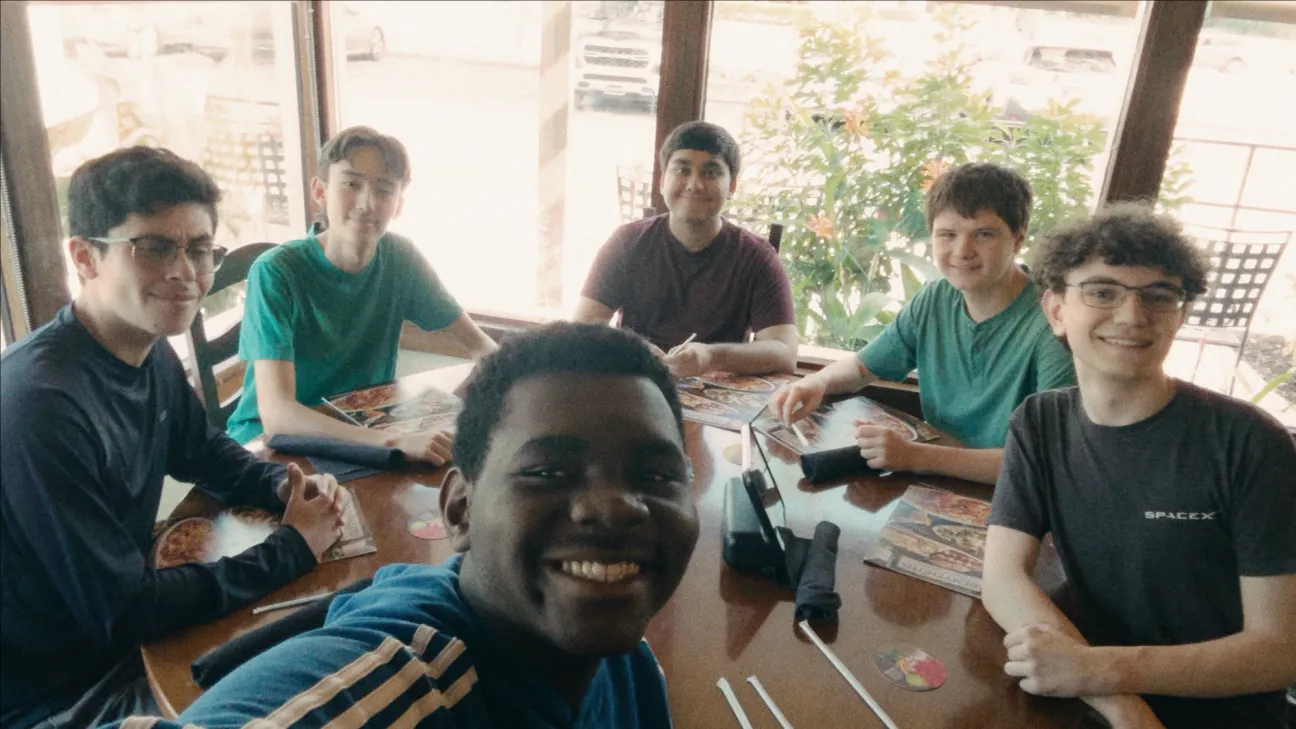 Jossaya and friends around a restaurant table