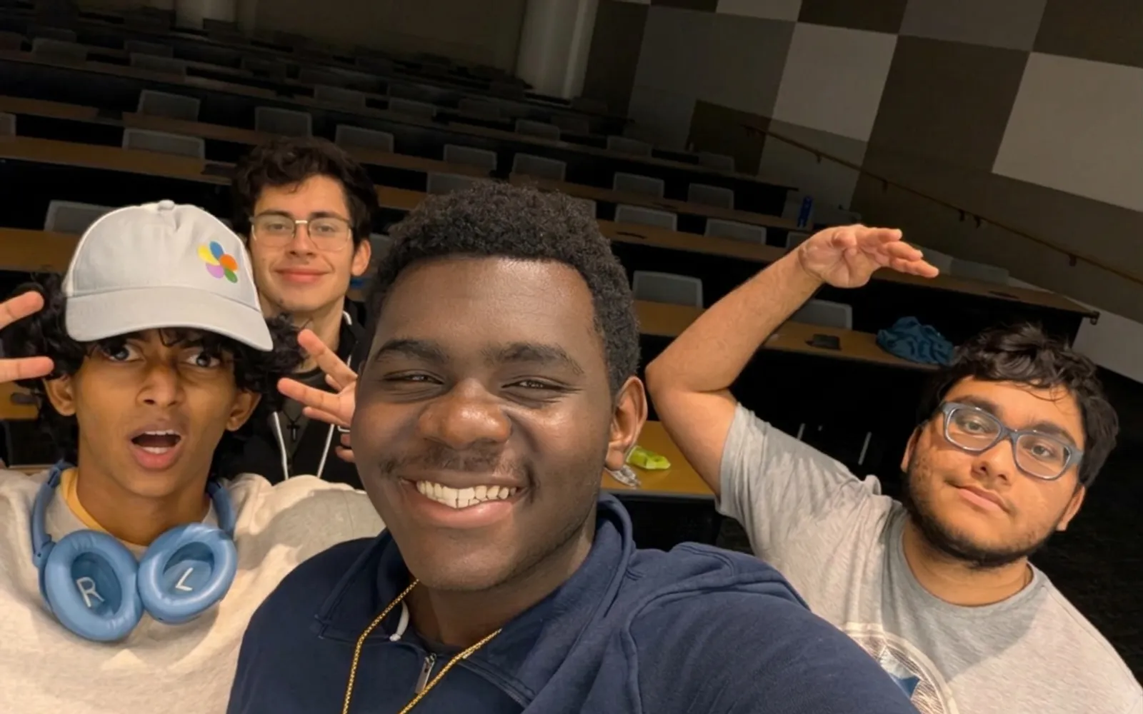 The SignSpeak team mugging for a selfie in a lecture hall